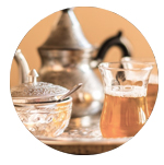teapot, sugar bowl and glass with tea