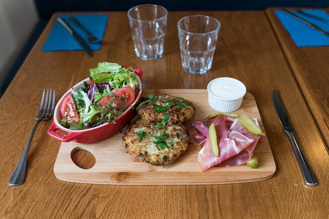 Plate of food salad, burger and ham