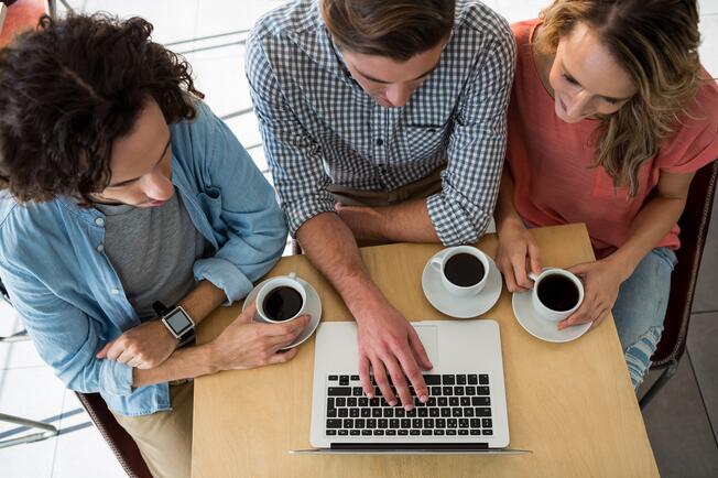 People looking at laptop
