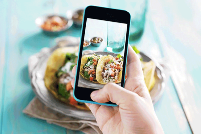 phone-taking-picture-of-a-taco-plate