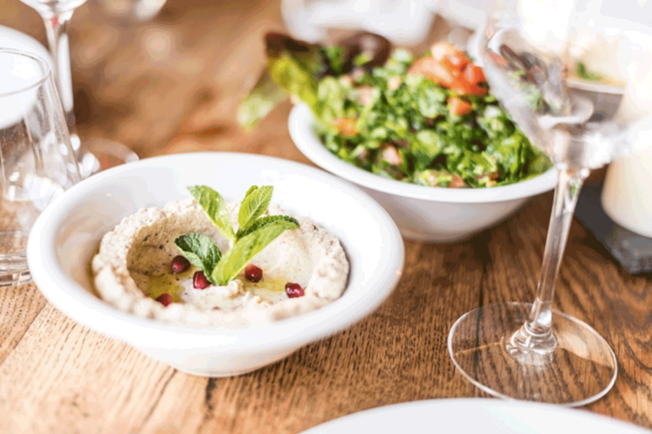 wooden-table-houmous-salad-wine-glass